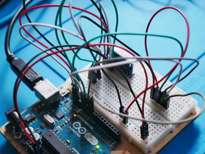 Close-up of a development board with jumper wires