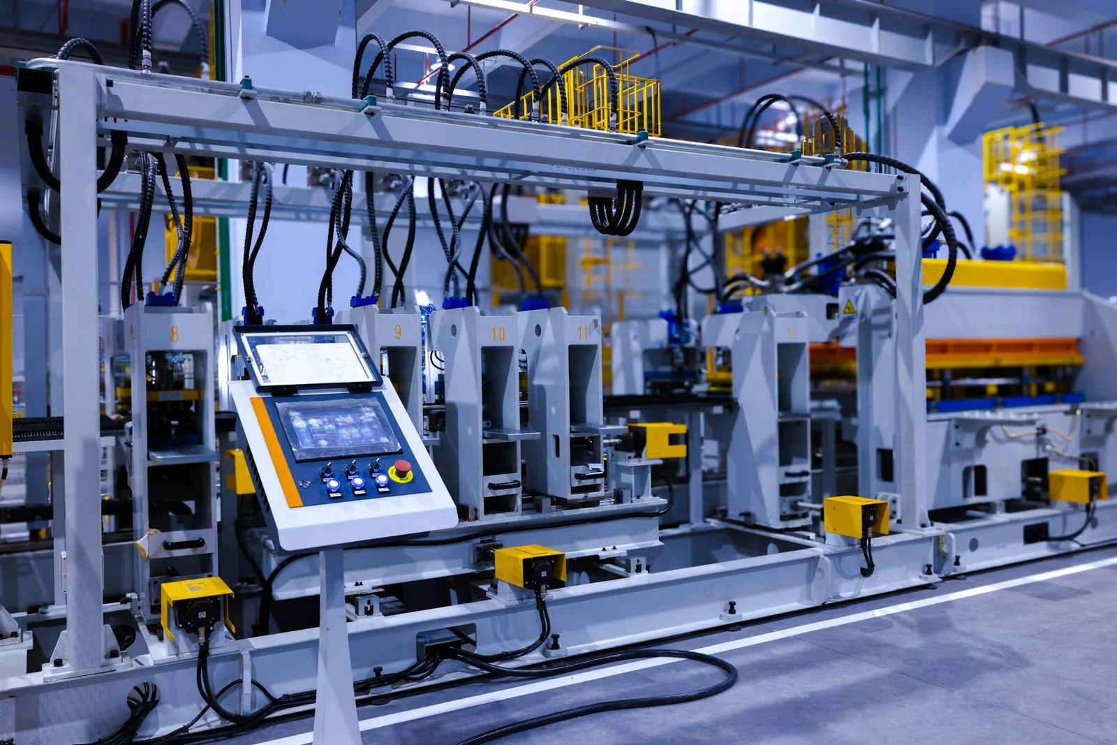 A touchscreen control panel on an industrial production machine