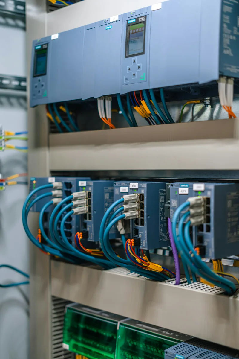 Industrial control panel with electronic modules and cables