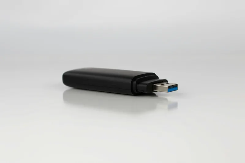 Close-up of a USB device on a white surface